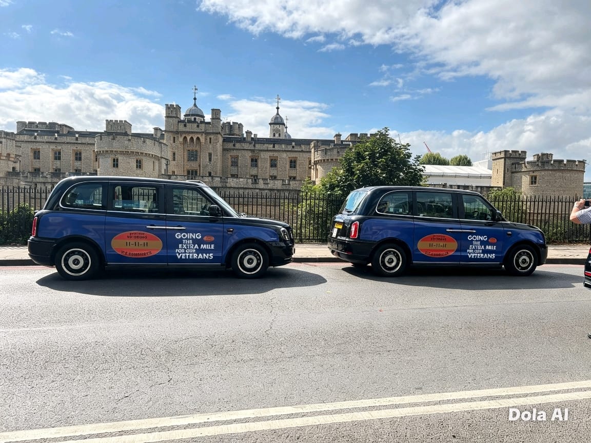 Two liveried taxis outside Tower of London